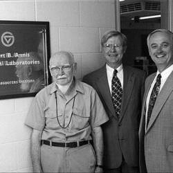 From left are Robert B. Annis, Ron Ward and Douglas Kindschi next to a plaque with GV circle logo, Robert B. Annis Analytical Laboratories, Water Resources Institute